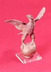Eagle with spread wings on a ball